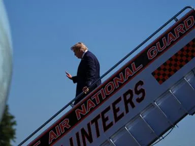 CNN says it was left off Air Force One for Trump's Saturday trip to a college football game